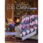 Book cover of 'Not Your Grandmother's Log Cabin' with a quilt draped over a sofa in a cozy living room.