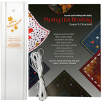 Book cover of 'Piping Hot Binding' by Susan K Cleveland with piping material displayed.
