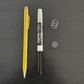Yellow pen and Expo marker on a dark gray background