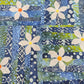 Patchwork Progression course sample - blue and green batik strip quilt with white daisy appliqué border on dark fabric