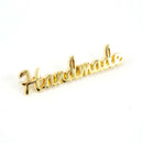 Emmaline Metal Bag Script Label 'Handmade'