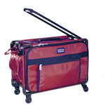 A dark red and black Tutto Machine Tote Medium carry-on with a telescopic pull bar and mesh pockets.